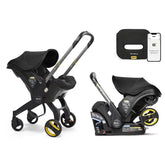 Doona Ultimate Peace of Mind Bundle Travel System - Black: 5-Point Harness, Rubber Tires, Rear Facing Seat