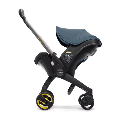 Doona Car Seat + Latch Base Travel System - Nitro Black: Rubber Tires, Aluminum Frame, Minimum Weight 4 Lbs, Weight 10 Lbs
