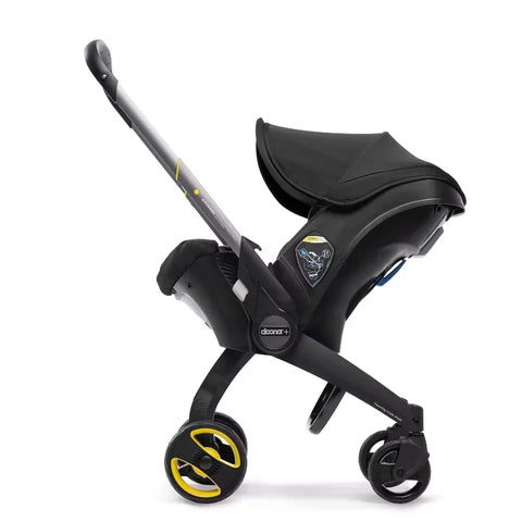Doona Car Seat + Latch Base Travel System - Nitro Black: Rubber Tires, Aluminum Frame, Minimum Weight 4 Lbs, Weight 10 Lbs