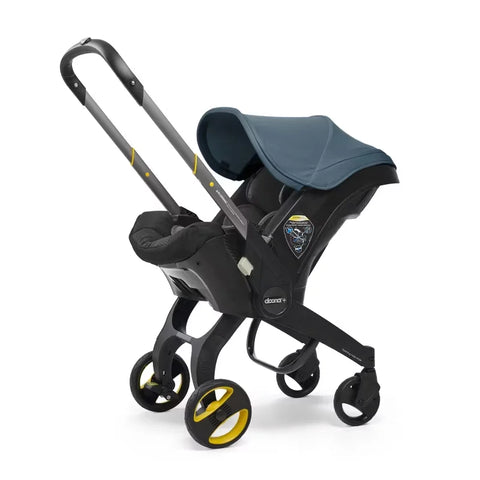 Doona Car Seat + Latch Base Travel System - Nitro Black: Rubber Tires, Aluminum Frame, Minimum Weight 4 Lbs, Weight 10 Lbs