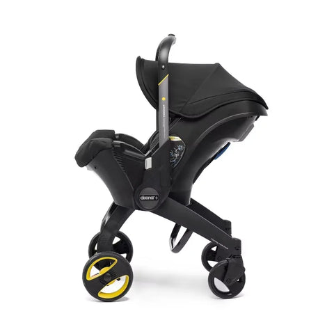 Doona Car Seat + Latch Base Travel System - Nitro Black: Rubber Tires, Aluminum Frame, Minimum Weight 4 Lbs, Weight 10 Lbs