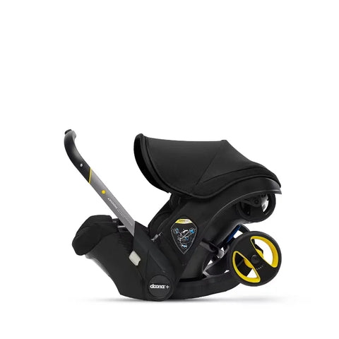 Doona Car Seat + Latch Base Travel System - Nitro Black: Rubber Tires, Aluminum Frame, Minimum Weight 4 Lbs, Weight 10 Lbs