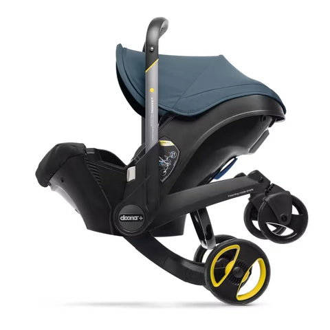 Doona Car Seat + Latch Base Travel System - Nitro Black: Rubber Tires, Aluminum Frame, Minimum Weight 4 Lbs, Weight 10 Lbs