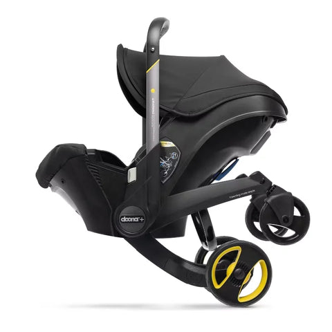 Doona Car Seat + Latch Base Travel System - Nitro Black: Rubber Tires, Aluminum Frame, Minimum Weight 4 Lbs, Weight 10 Lbs