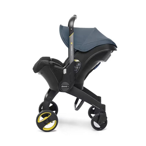 Doona Car Seat + Latch Base Travel System - Nitro Black: Rubber Tires, Aluminum Frame, Minimum Weight 4 Lbs, Weight 10 Lbs