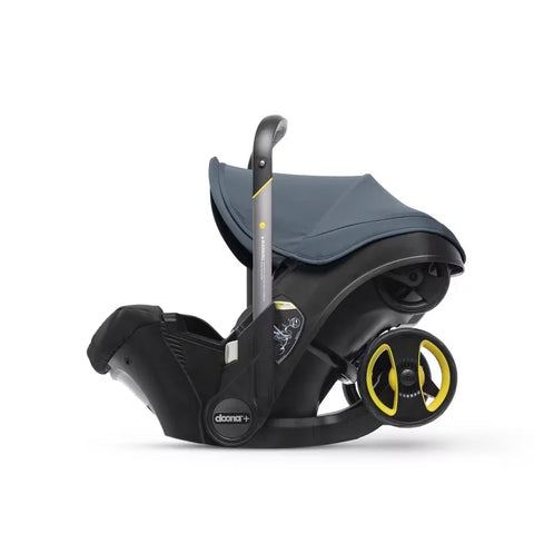 Doona Car Seat + Latch Base Travel System - Nitro Black: Rubber Tires, Aluminum Frame, Minimum Weight 4 Lbs, Weight 10 Lbs