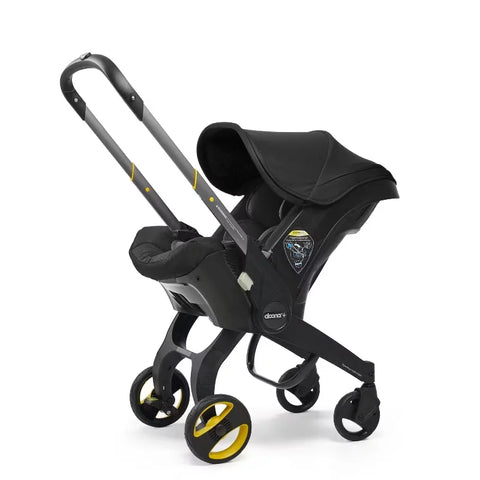 Doona Car Seat + Latch Base Travel System - Nitro Black: Rubber Tires, Aluminum Frame, Minimum Weight 4 Lbs, Weight 10 Lbs